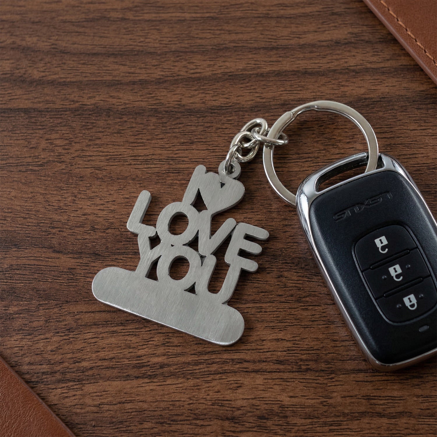 Premium metal "Love You" keychain by Wukusy featuring a sleek heart design and durable keyring.