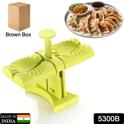 Wukusy 5300b dumpling maker mold with double heads, brown box, for easy household dumpling wrapping and shaping in the kitchen.