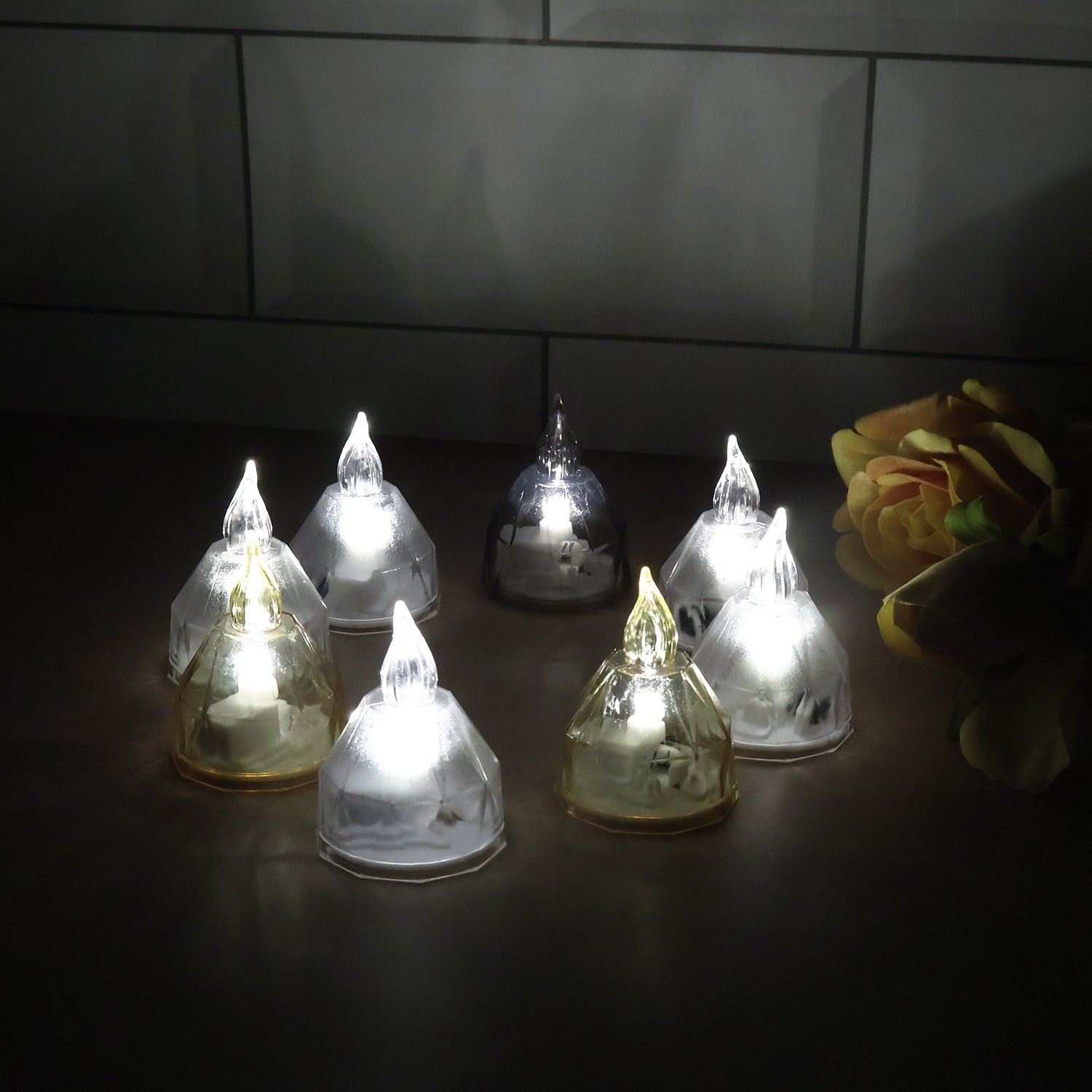 Set of 8 Wukusy LED flameless decorative diyas for home decor, realistic candle-like appearance with warm glow.