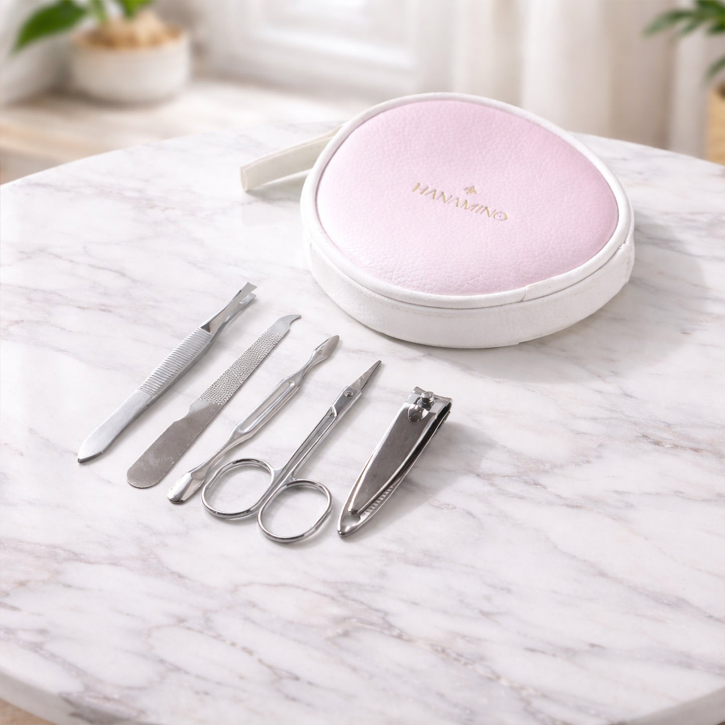 Wukusy 5-in-1 manicure and pedicure grooming kit with nail clippers, files, and tools in a storage case for personal nail care.