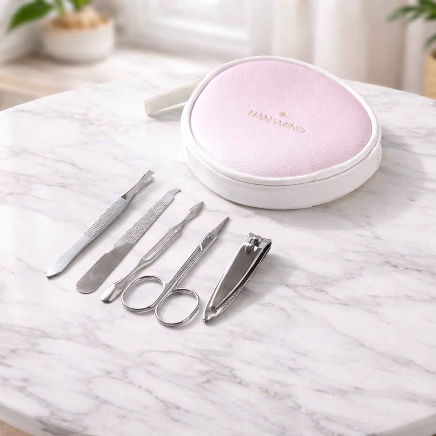 Wukusy 5-in-1 manicure and pedicure grooming kit with nail clippers, files, and tools in a storage case for personal nail care.