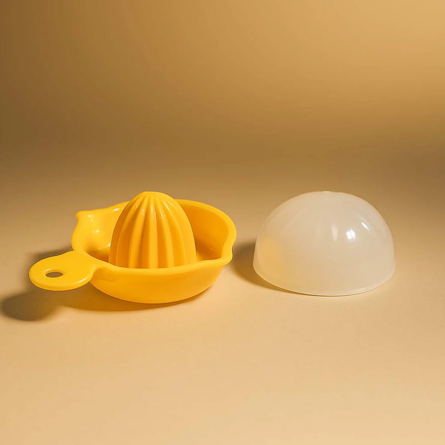 Yellow Wukusy hand-operated citrus juicer for lemons and oranges, manual squeezer for home use, compact and easy to use.