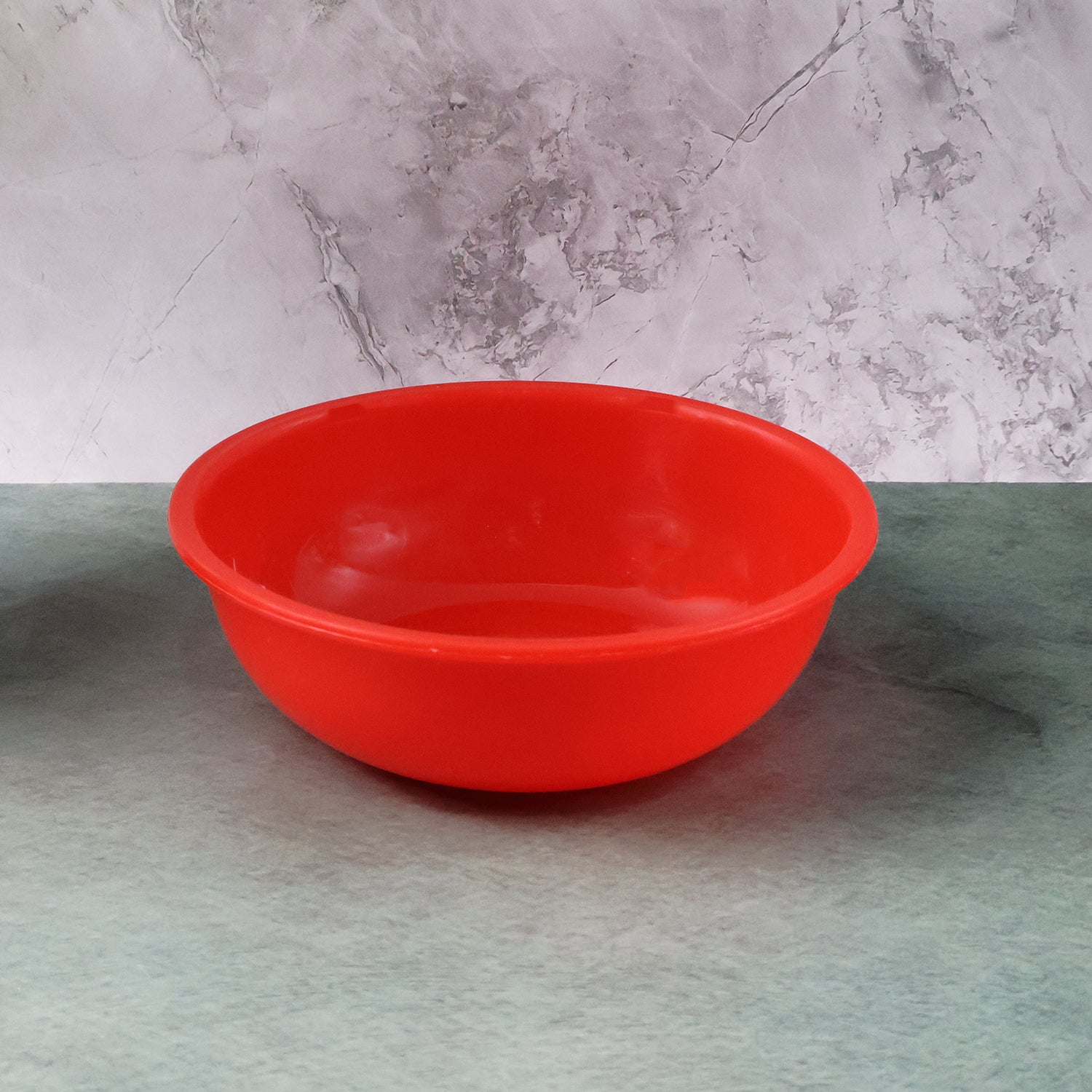 Red plastic 6-inch round deep serving bowl by Wukusy, ideal for salads, sides, or snacks in home and kitchen settings.