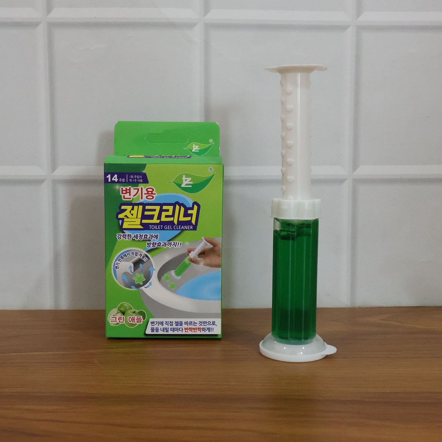 Automatic toilet cleaning gel dispenser by Wukusy, mounted on toilet bowl, ready to dispense cleaning gel for hygienic bathroom maintenance.