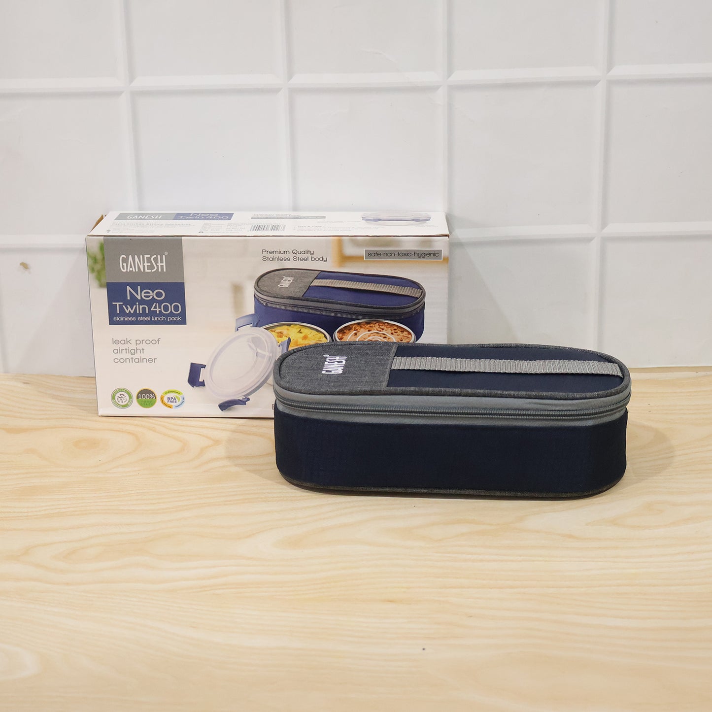 Wukusy Ganesh Neo Twin 400 lunch box set with insulated carry bag, featuring two stainless steel containers and a carrying bag.