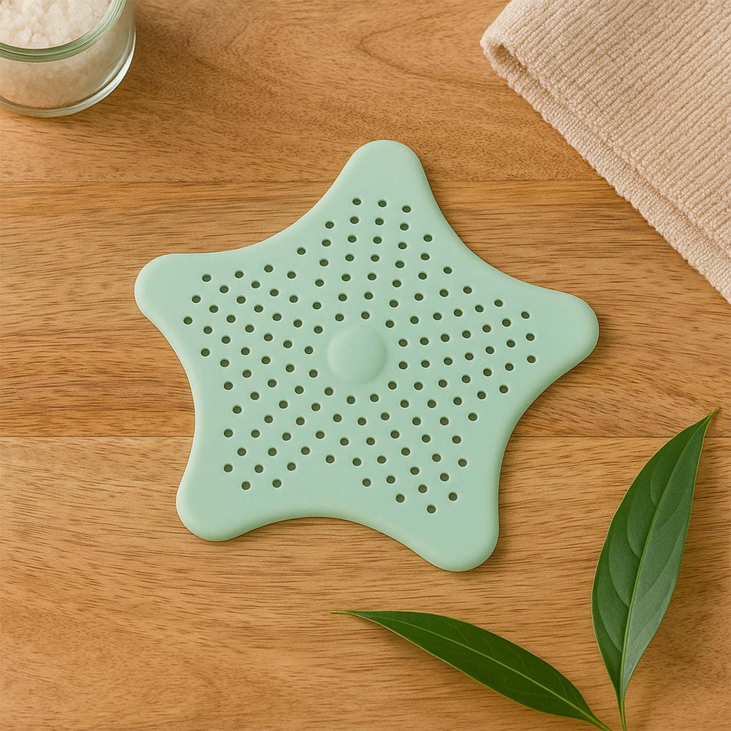 Mint green silicone star-shaped sink filter by Wukusy, bathroom hair catcher drain strainer for basin.