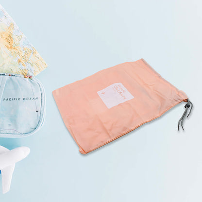 Wukusy 4-piece waterproof nylon travel storage bags with drawstrings for organizing clothes, shoes, and accessories in luggage.