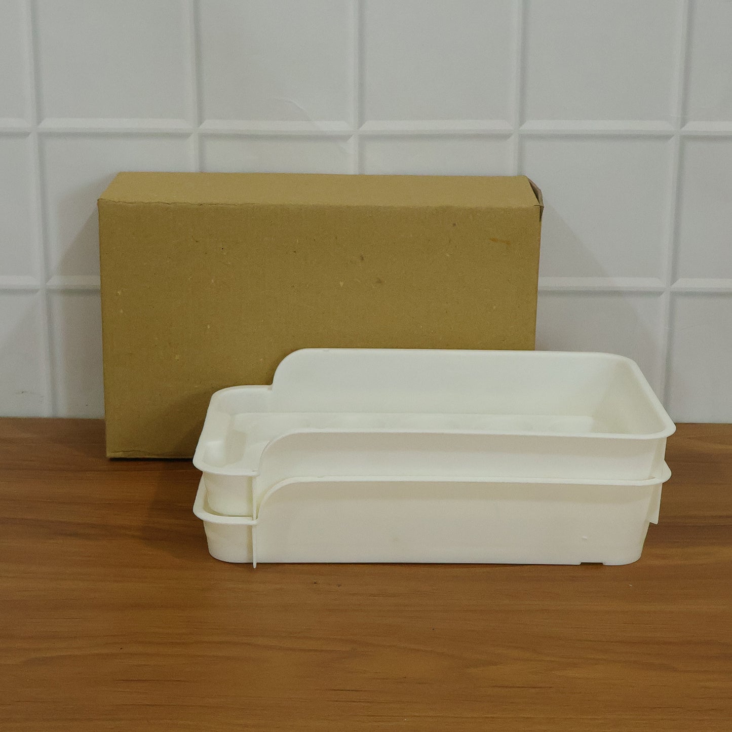 Wukusy plastic egg storage tray holder set with two clear trays for organizing eggs in the refrigerator or kitchen.