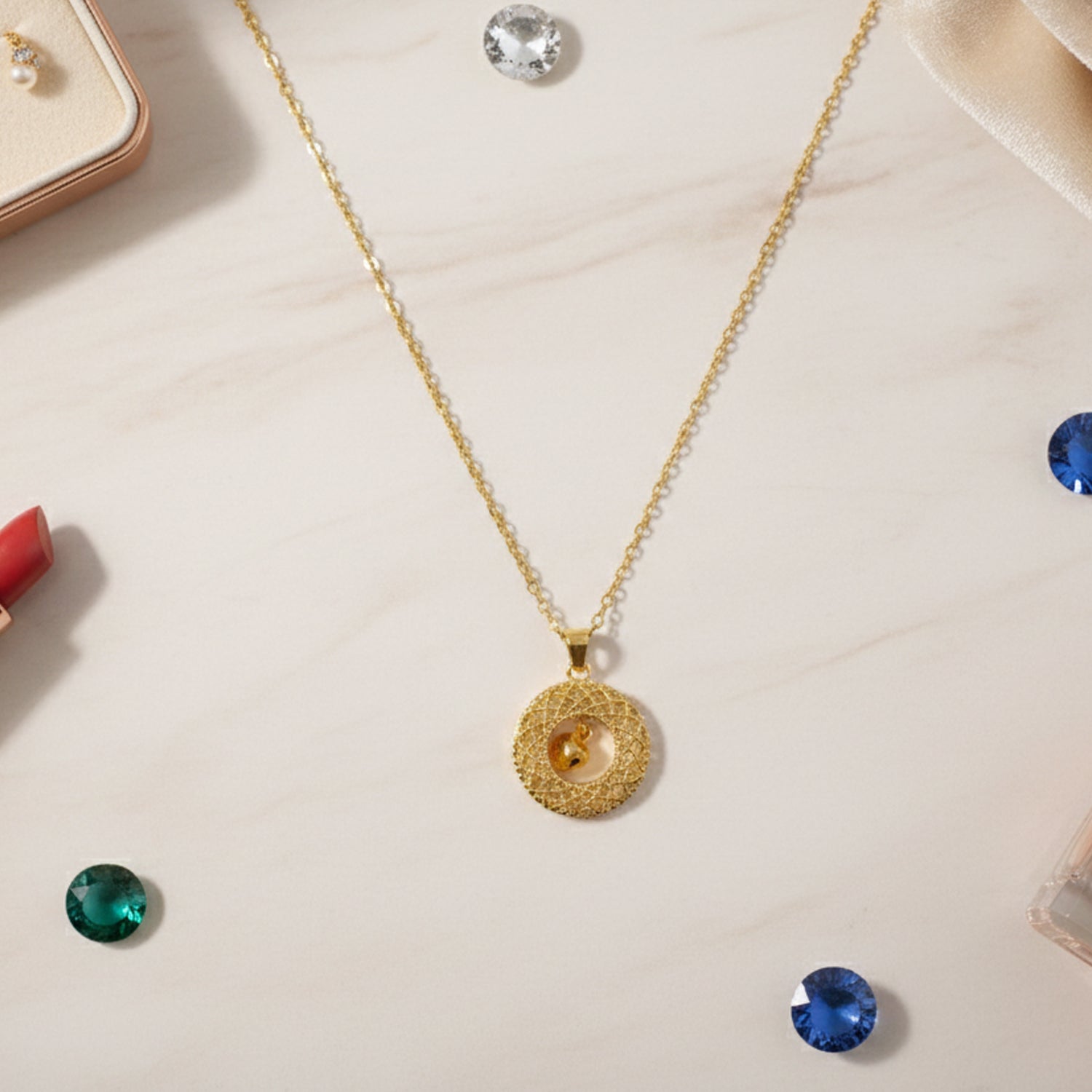 Gold-tone round Jhumka pendant chain necklace by Wukusy, featuring intricate traditional design with a round Jhumka pendant.
