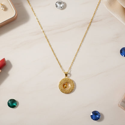 Gold-tone round Jhumka pendant chain necklace by Wukusy, featuring intricate traditional design with a round Jhumka pendant.
