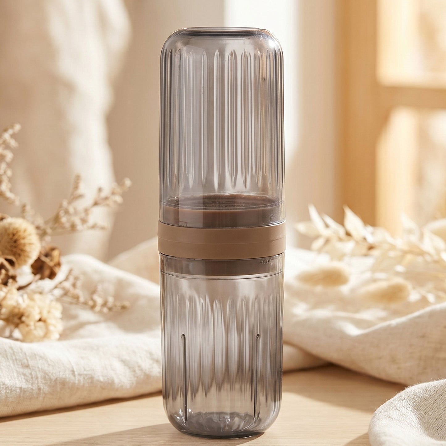 Portable plastic travel foldable glass by Wukusy showing a compact, foldable drinking glass ready for on-the-go use