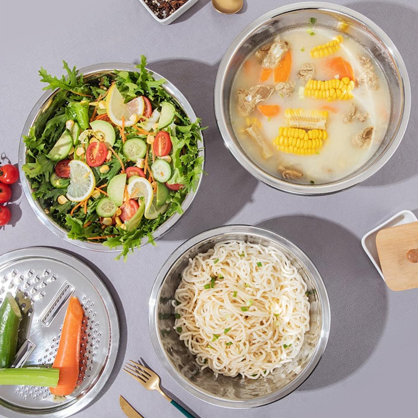 Wukusy 3-in-1 stainless steel mixing, straining, and grater bowl set with multiple attachments for versatile kitchen use