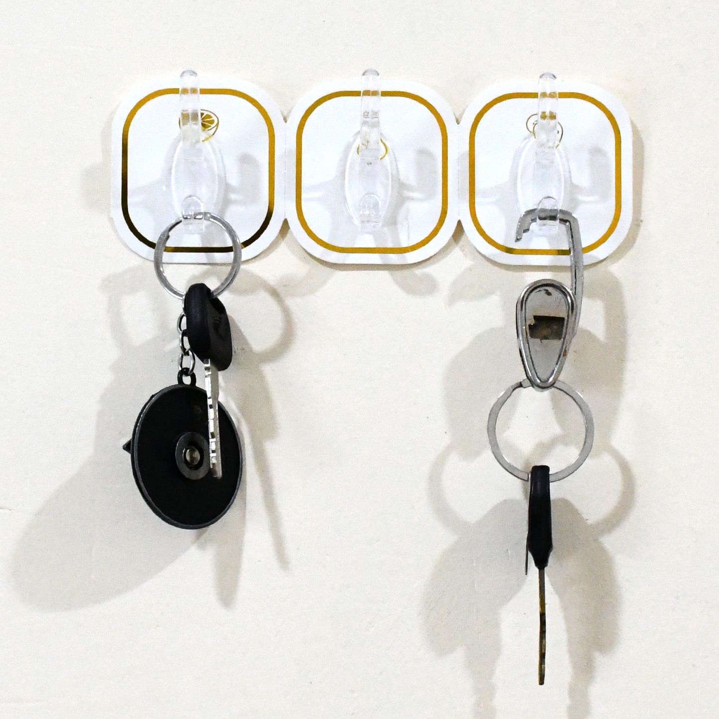 Set of six transparent adhesive wall hooks by Wukusy, ideal for home improvement and hanging lightweight items.