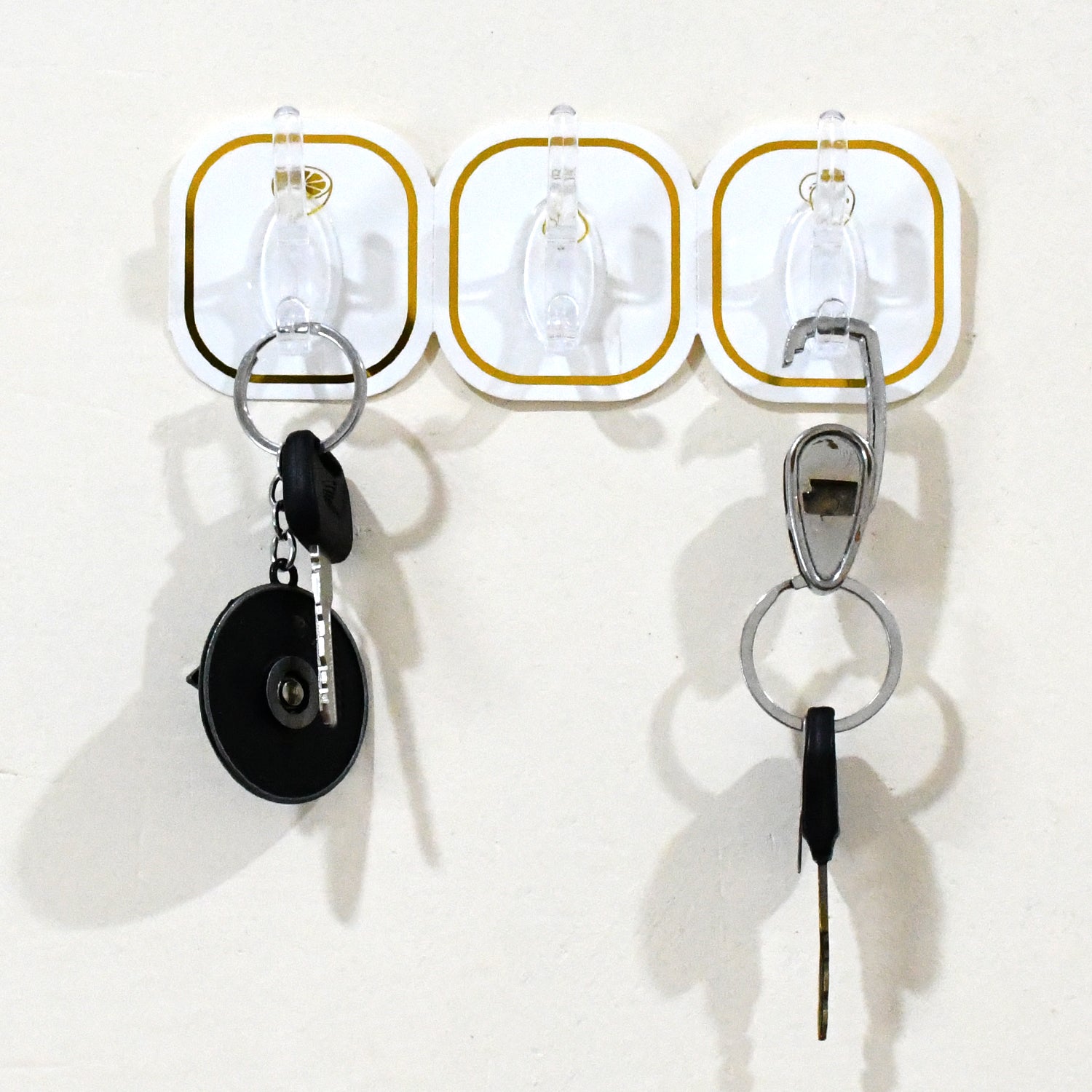 Set of six transparent adhesive wall hooks by Wukusy, ideal for home improvement and hanging lightweight items.