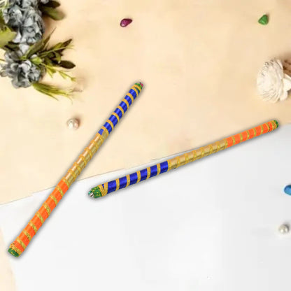 Pair of traditional decorative Dandiya sticks for Navratri Garba by Wukusy, featuring intricate designs and vibrant colors.