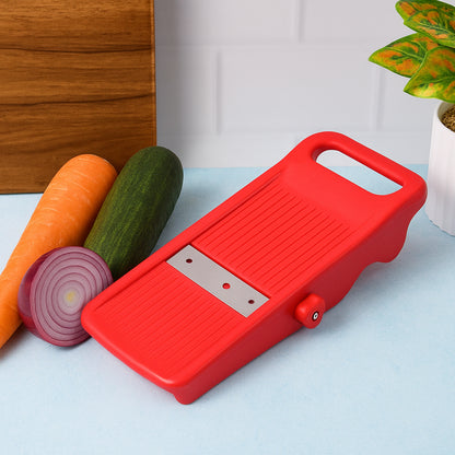 Wukusy Supermom Easy Plus vegetable slicer, a versatile kitchen tool with multiple blades for quick vegetable prep, shown on countertop.