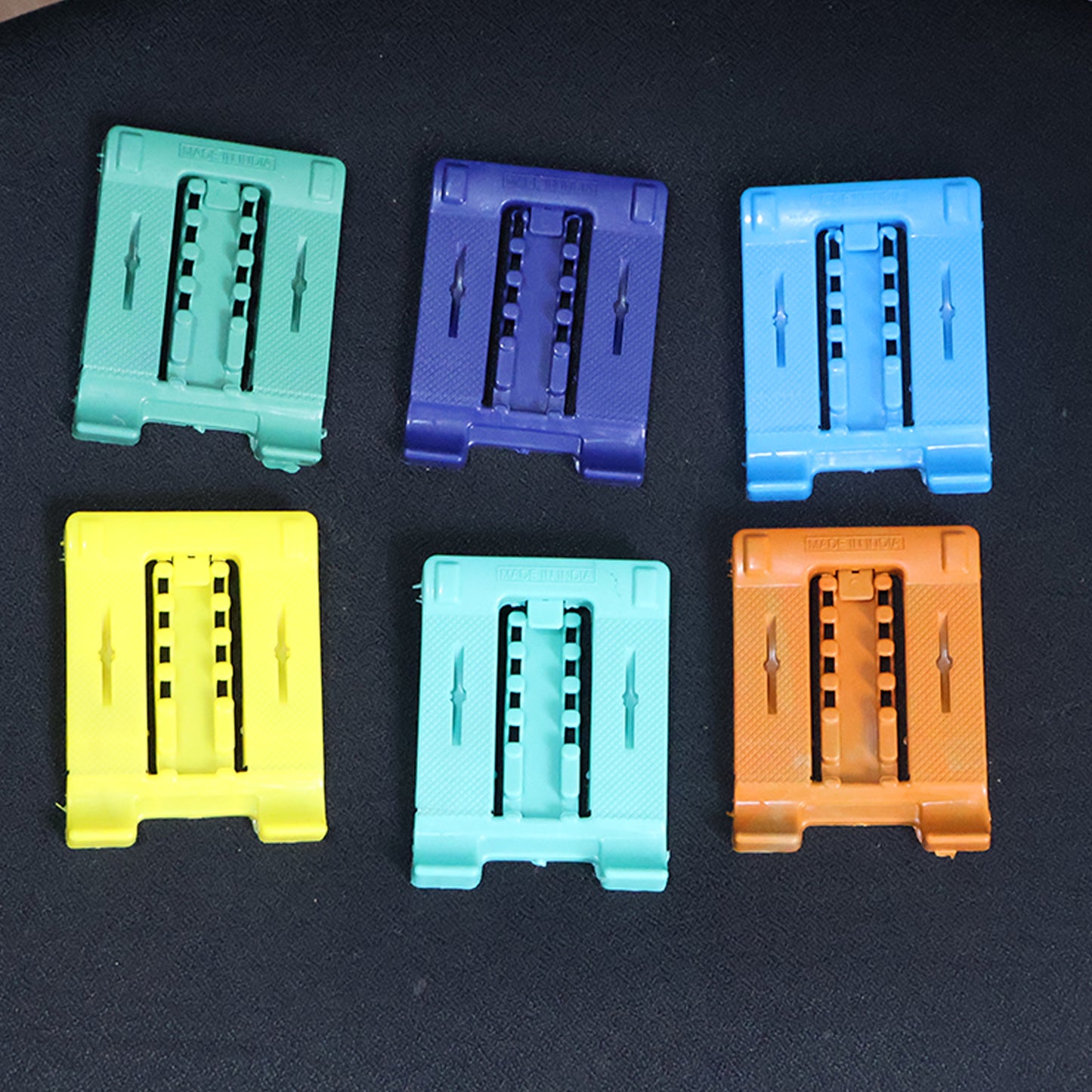 Wukusy 610 adjustable 4-step foldable mobile stand holder for smartphones, showing its compact design and adjustable angles.