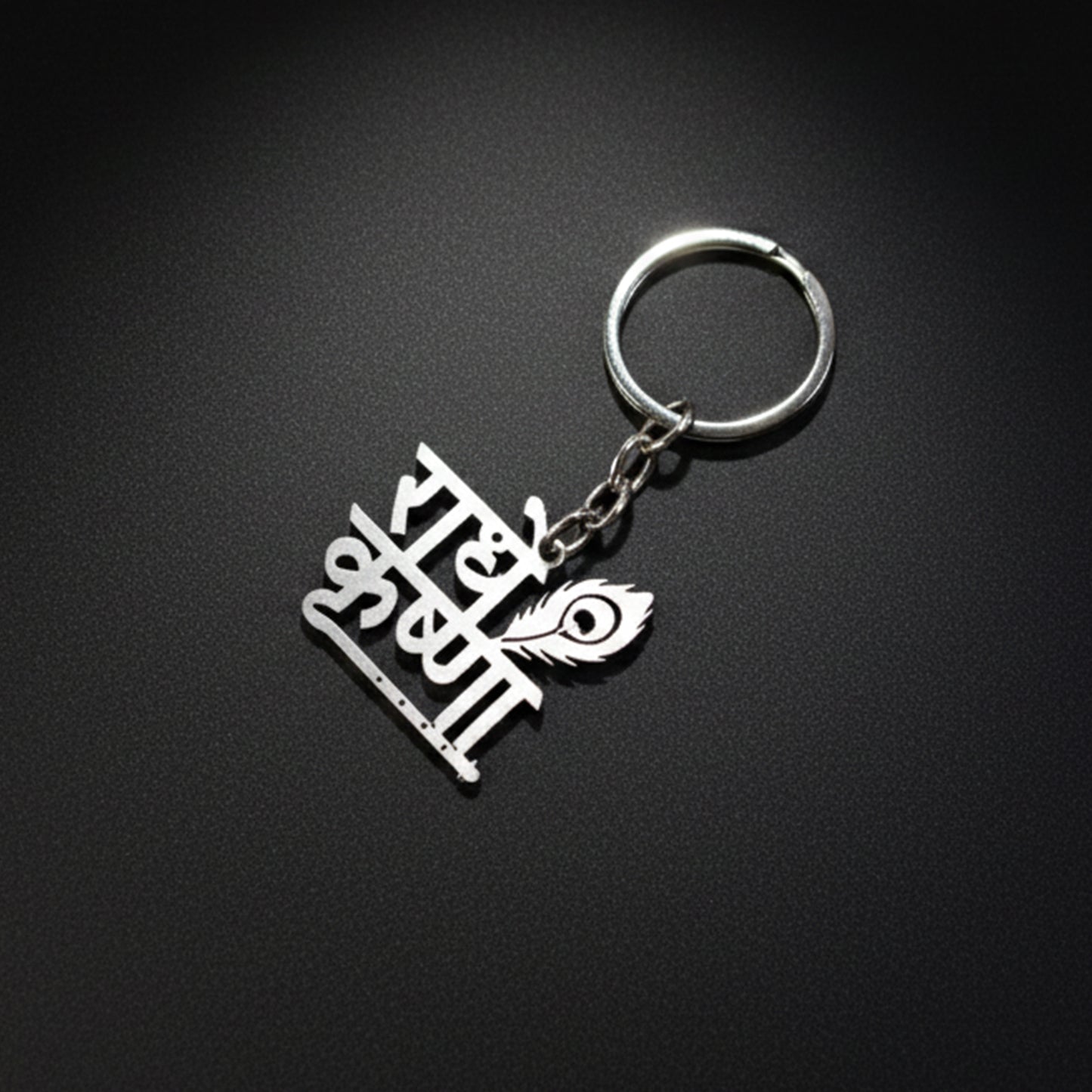 Silver Radhe Krishna metal keychain from Wukusy featuring intricate religious design on a keyring.