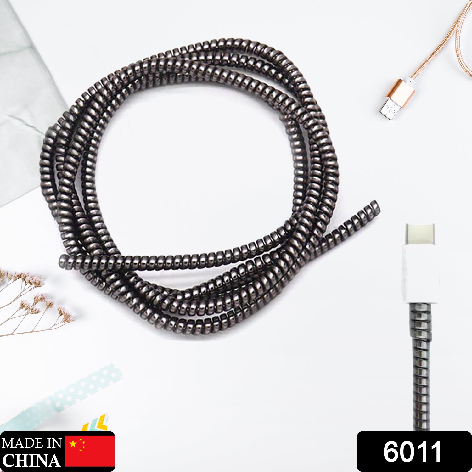 Wukusy Metallic Finish Cable Spiral Protector wrapping Mac charging cable to prevent damage and improve durability.