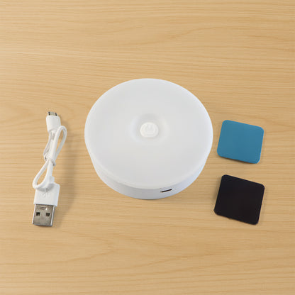 Wukusy rechargeable motion sensor night light illuminating a dark hallway with a sleek, compact design.