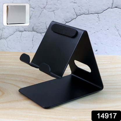 Wukusy metal universal mobile and tablet stand holder on a flat surface, adjustable support for smartphones and tablets.
