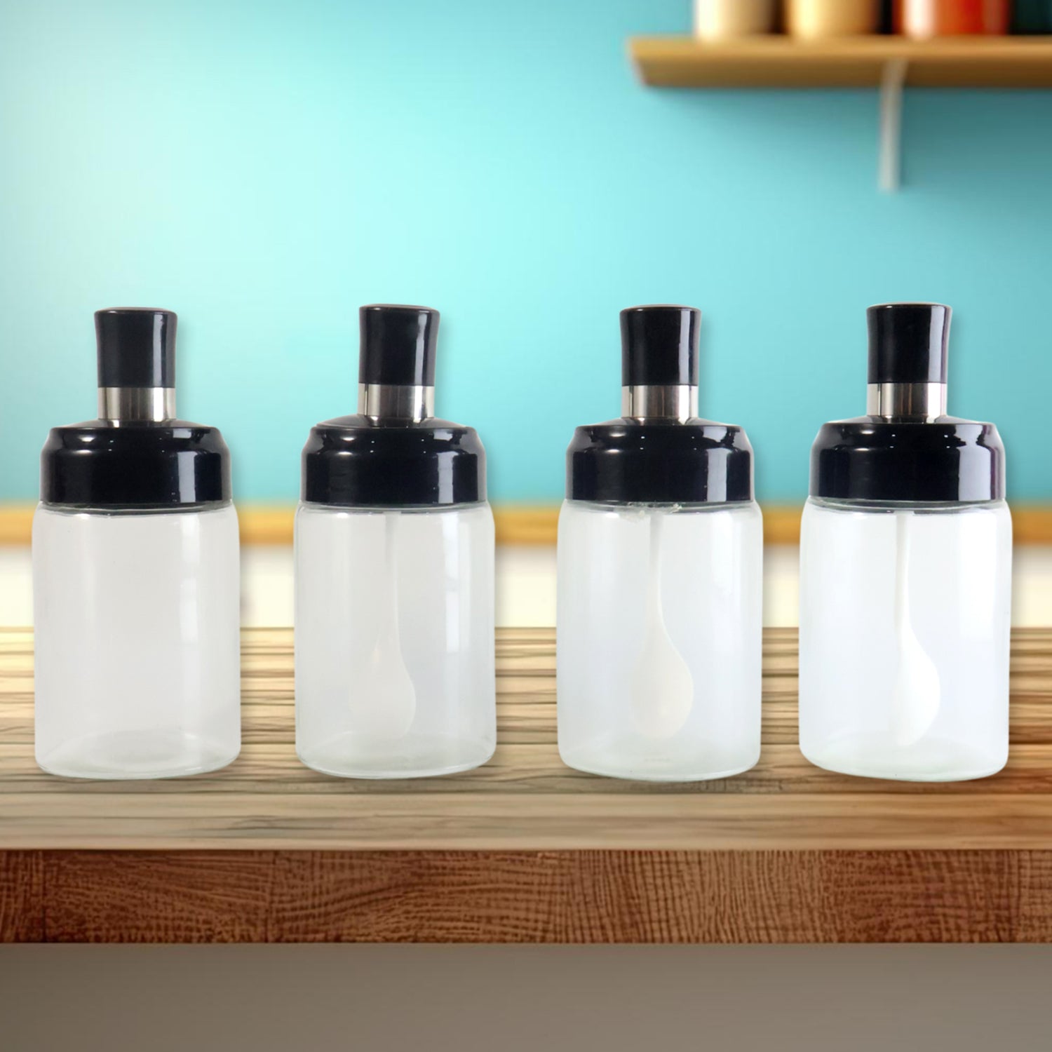 Set of four transparent spice jars with airtight lids and spoons, perfect for kitchen storage by Wukusy.