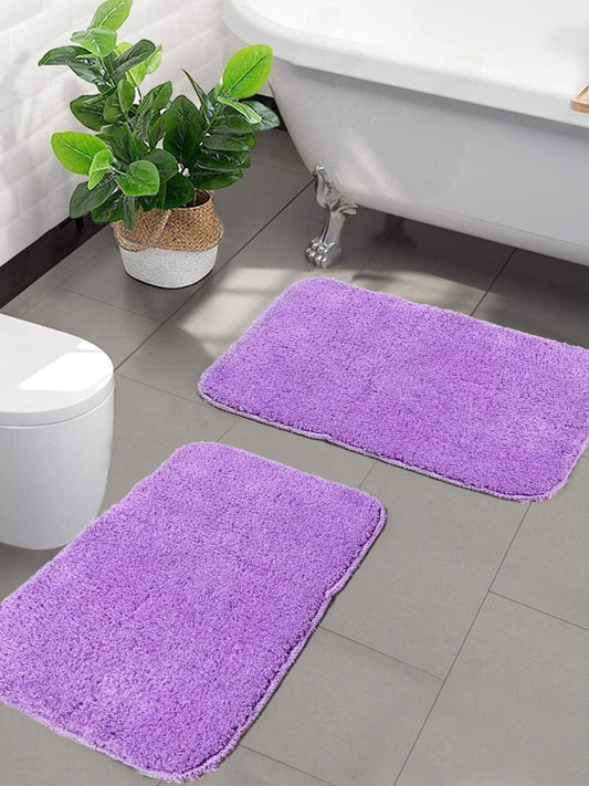 Seasons microfiber anti-skid bath mats in purple, set of 2, with textured surface and non-slip backing for safety and comfort.