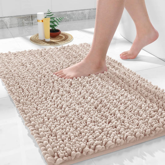 Beige Seasons soft bath mat for bathroom, plush and absorbent, with non-slip backing for safety and comfort.