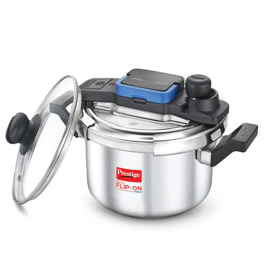 Seasons Prestige Svachh Flip-On 5L stainless steel induction bottom pressure cooker on kitchen countertop.