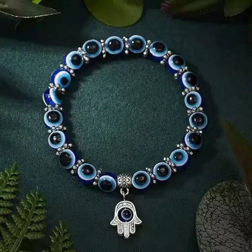 Ekom Evil Eye adjustable bracelet for women, featuring blue eye charm and silver-tone beads on a flexible band.