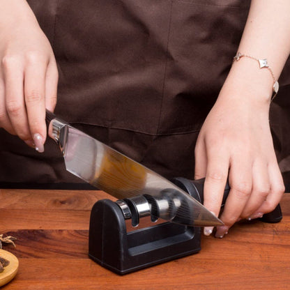 Wukusy 3-stage manual knife sharpener for steel and ceramic knives, featuring sharpening slots and ergonomic handle.