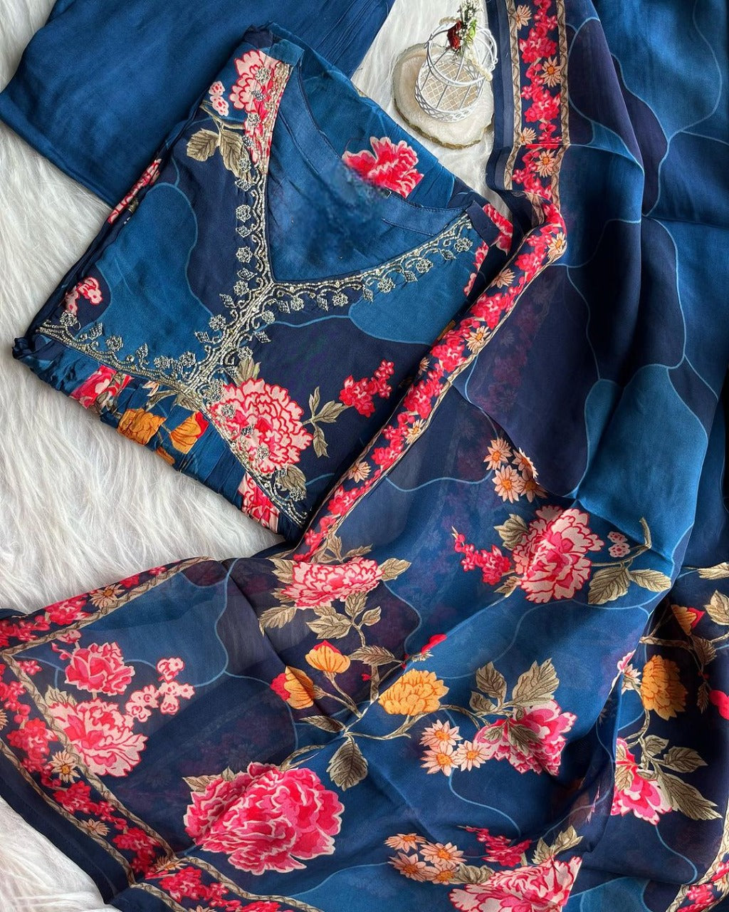 Sky blue embroidered designer suit by Drpshippr, featuring intricate embroidery and elegant fabric, displayed on a mannequin.