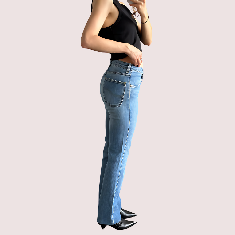 Light blue high waist denim jeans for women by Snazzyway, showing fit and classic style on a model.