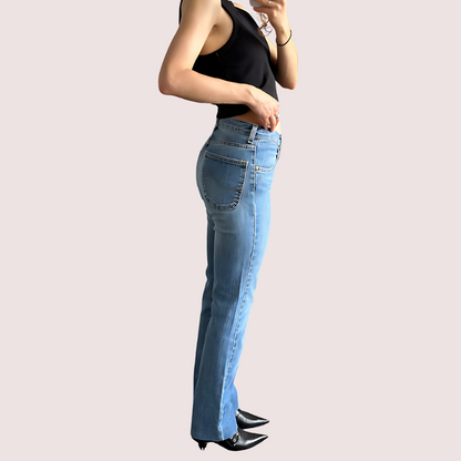 Light blue high waist denim jeans for women by Snazzyway, showing fit and classic style on a model.