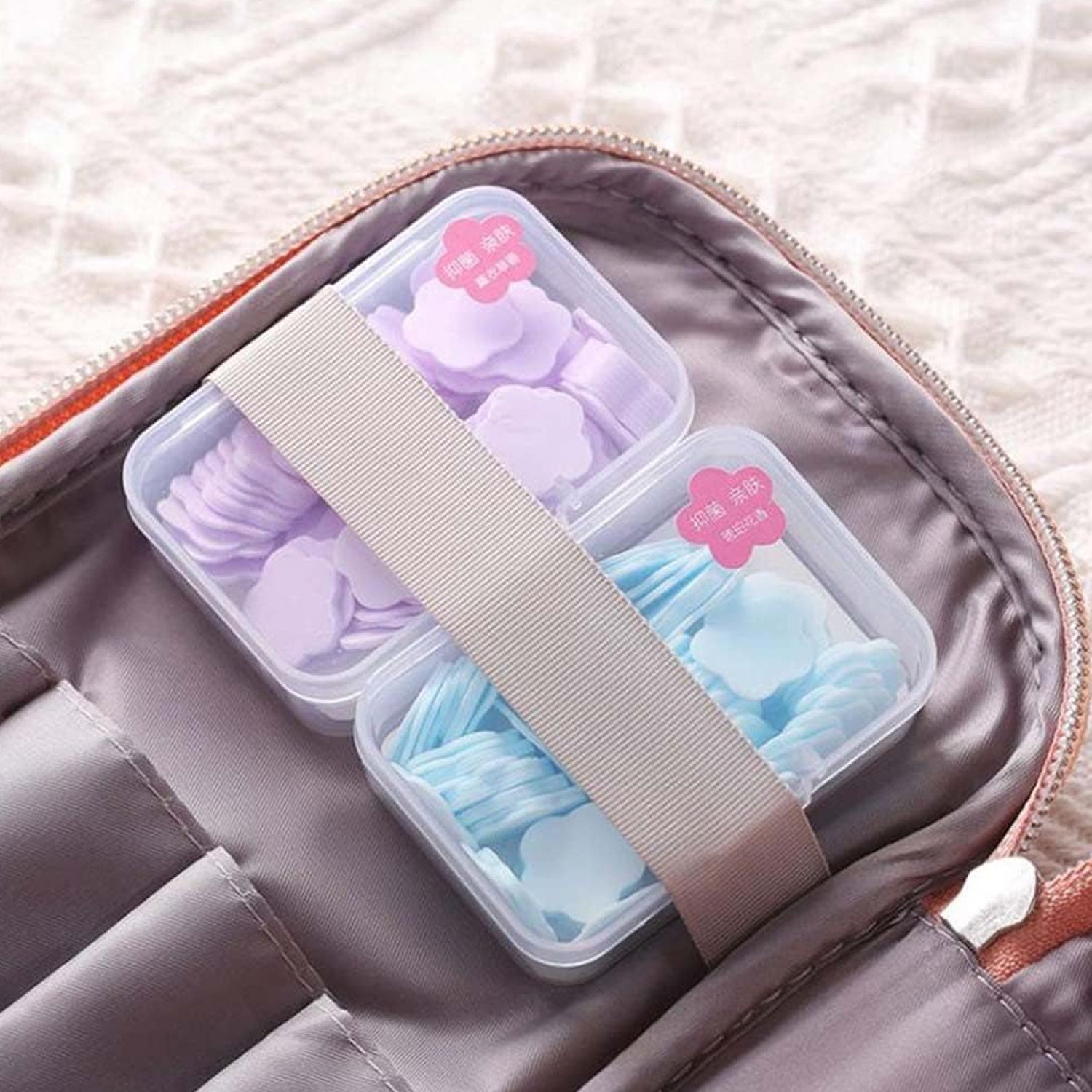 Set of 100 Wukusy mini portable travel soap paper sheets in colorful flower shapes, ideal for home and travel hygiene.