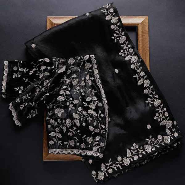 Black Rangoli silk saree from Drpshippr with intricate design and matching blouse piece, perfect for traditional women’s wear.