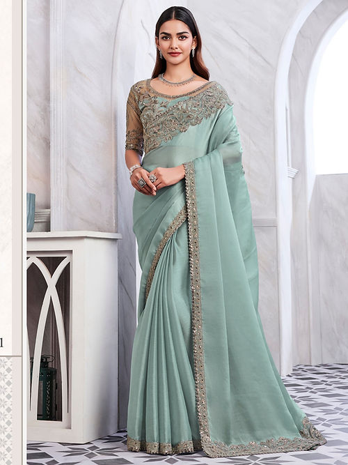 Summer green embroidered silk saree from Drpshippr's women's collection featuring intricate embroidery and elegant drape.