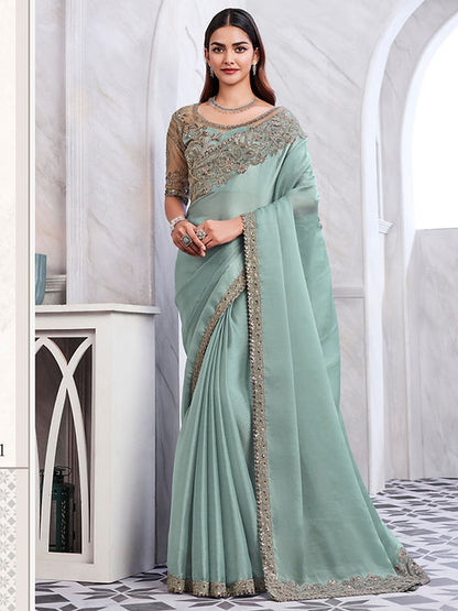 Summer green embroidered silk saree from Drpshippr's women's collection featuring intricate embroidery and elegant drape.