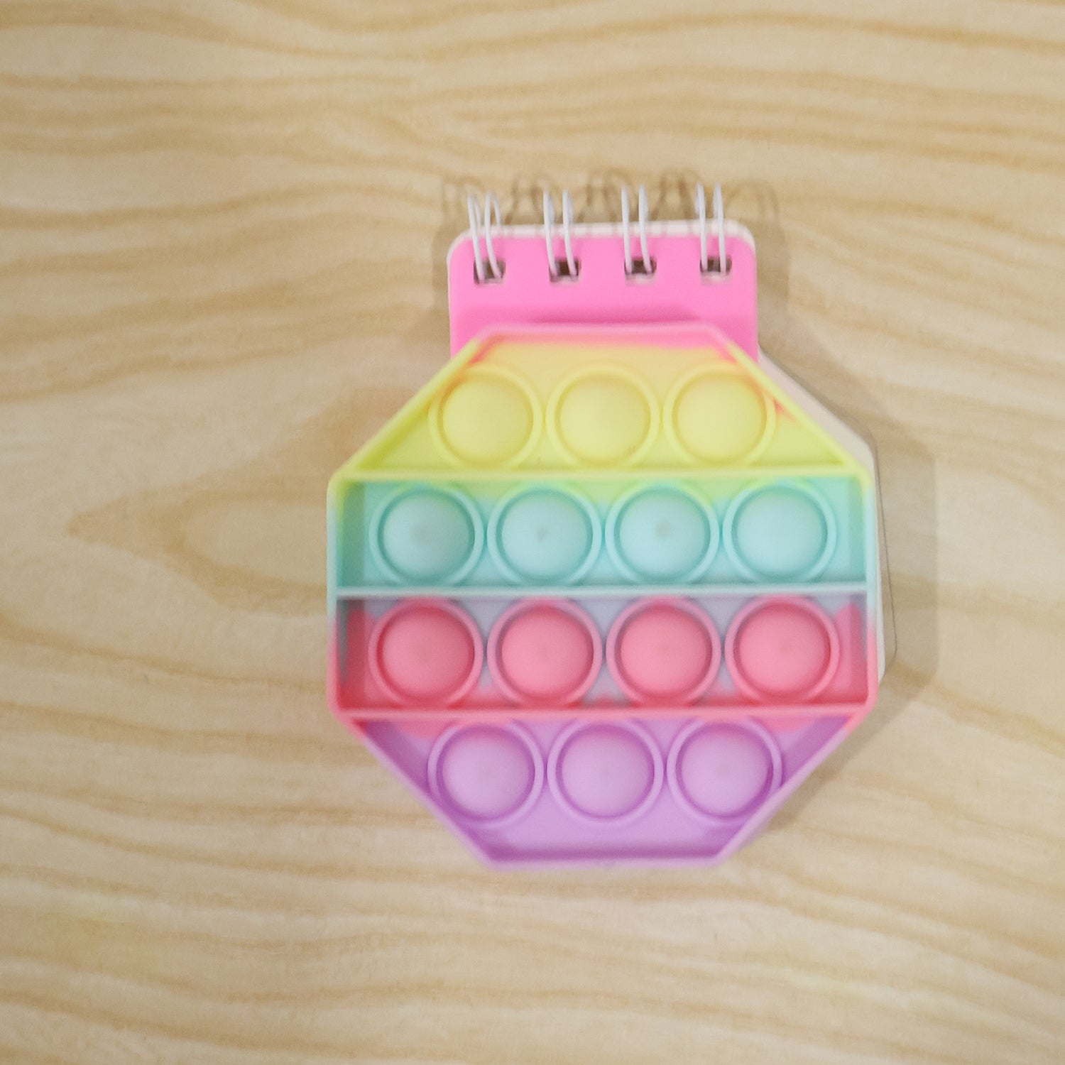 Wukusy pastel hexagon Push Bubble Pop It fidget diary with a notebook design, perfect for kids to enjoy sensory play and note-taking.