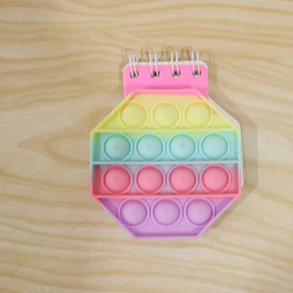 Wukusy pastel hexagon Push Bubble Pop It fidget diary with a notebook design, perfect for kids to enjoy sensory play and note-taking.