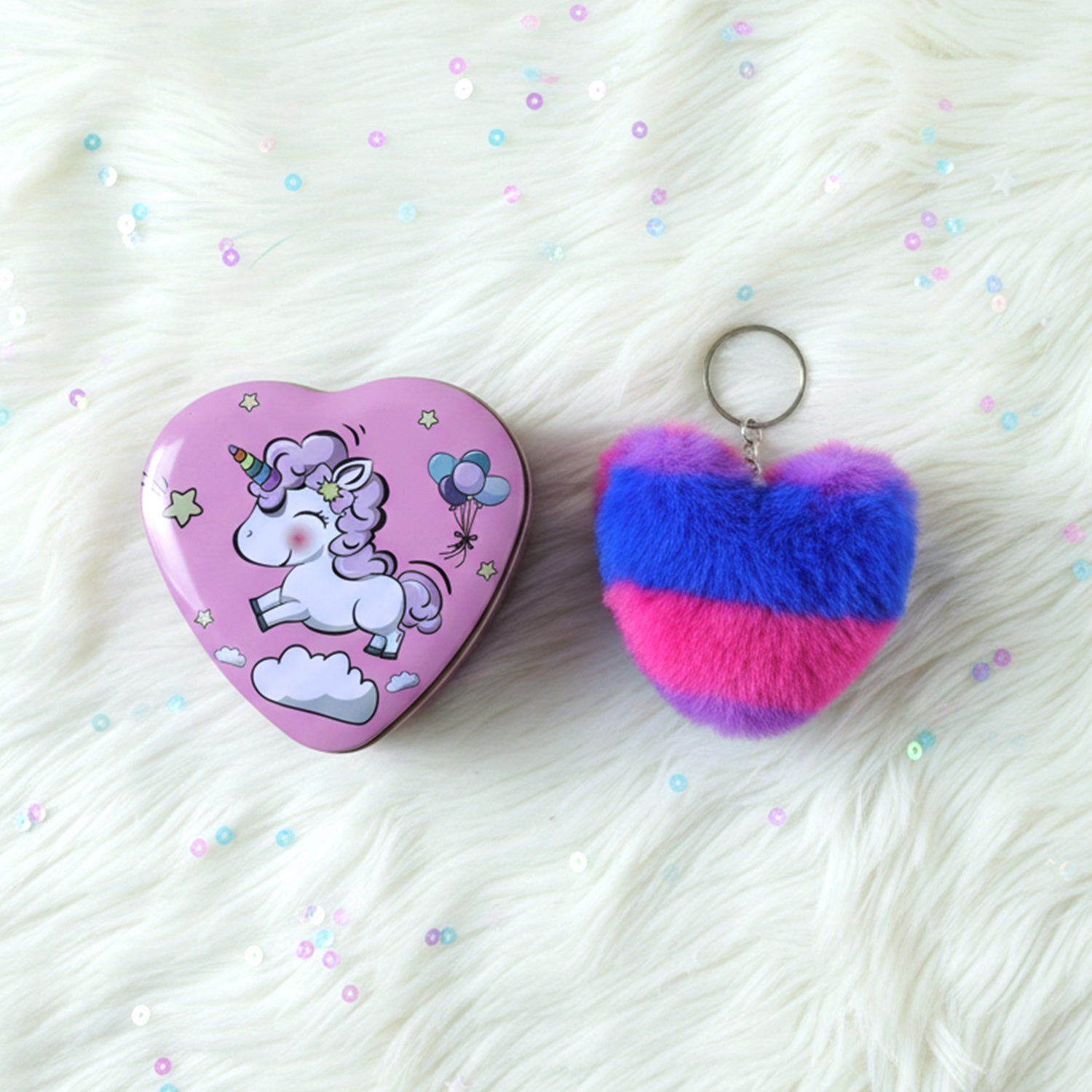 Two plush heart-shaped keychains in a gift box from Wukusy, featuring soft fabric and charming heart designs.