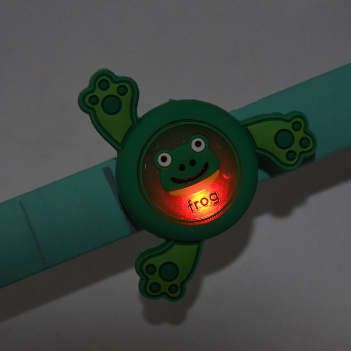Colorful LED spinning slap bracelet wristband for kids featuring cartoon characters, made by Wukusy, ideal as a fun toy accessory.