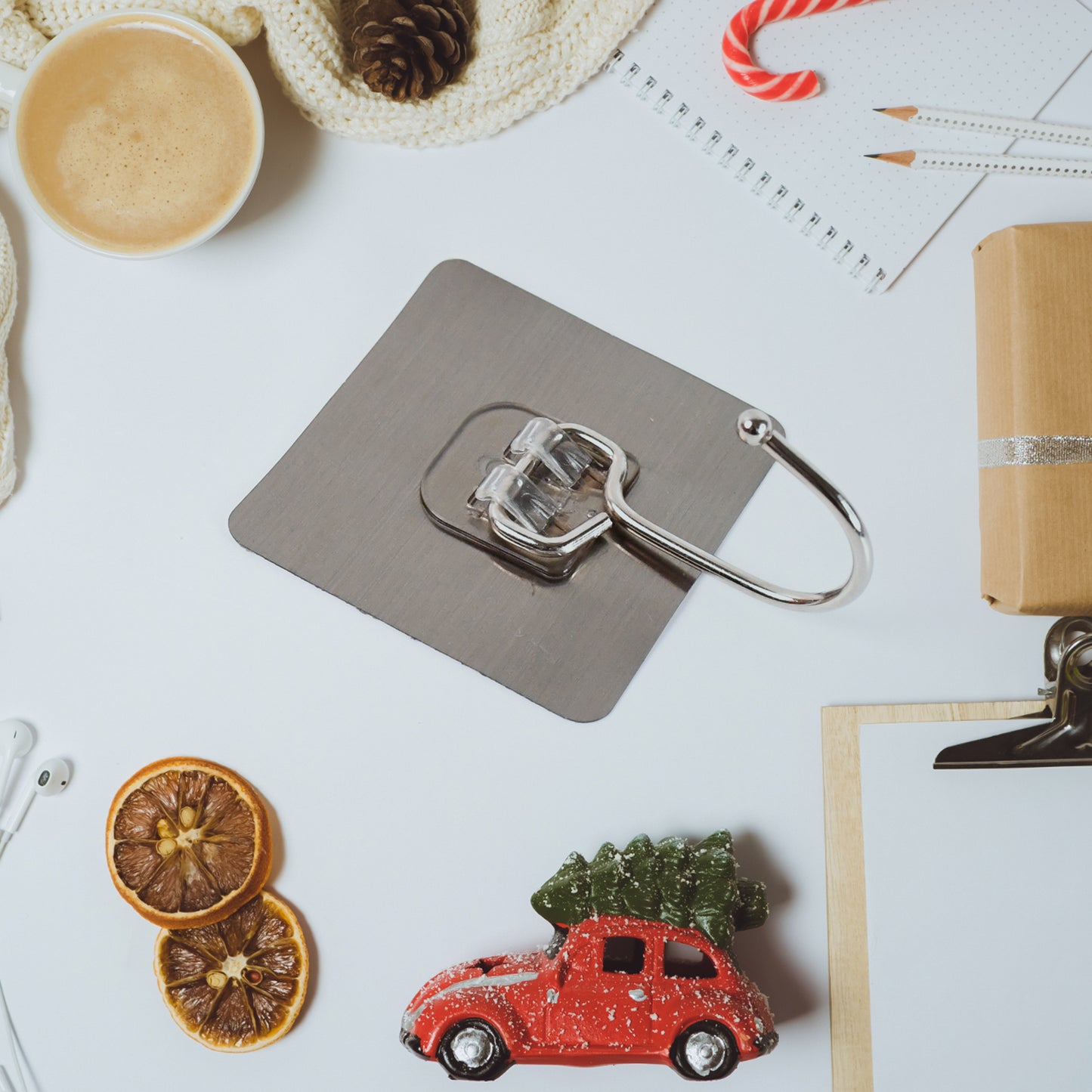 Large stainless steel self-adhesive wall hook from Wukusy, ideal for home and kitchen organization, shown attached to a wall surface.
