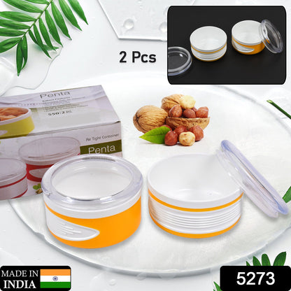 Wukusy 5273 airtight plastic storage container set with two 550ml containers, transparent with blue lids for food storage.