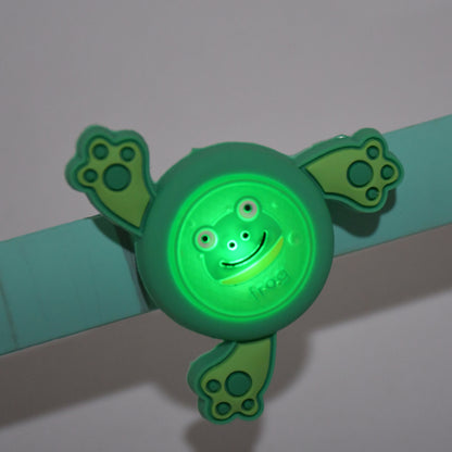 Colorful LED spinning slap bracelet for kids, cartoon design by Wukusy, worn on wrist as fun toy accessory.
