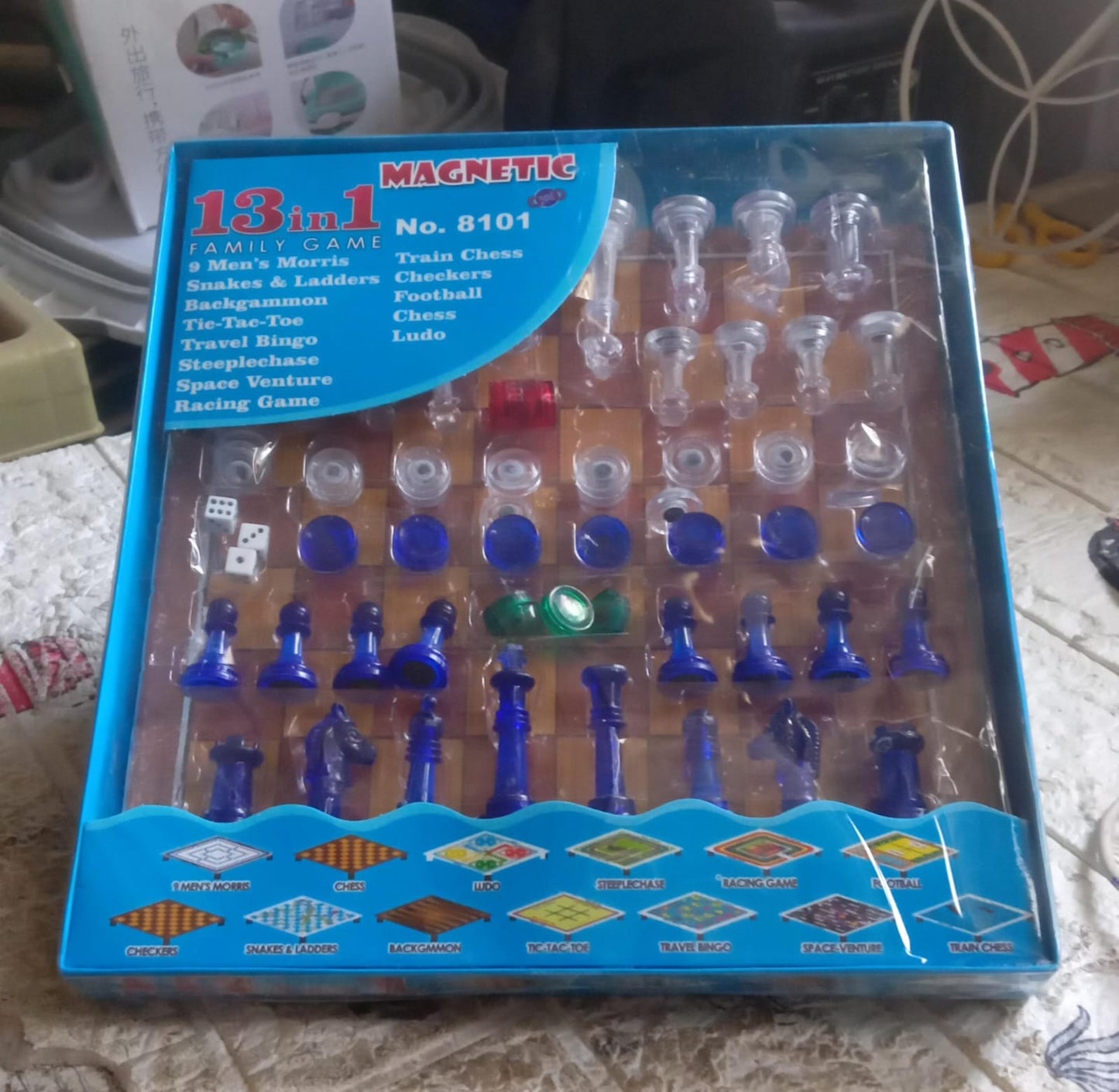 Wukusy 13-in-1 family board game set featuring chess, snakes and ladders, Ludo, tic-tac-toe, checkers, and more for kids.