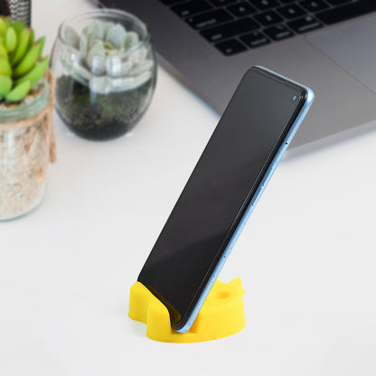 Colorful apple-shaped plastic mobile stand with integrated pen holder, ideal for desk organization and phone viewing.