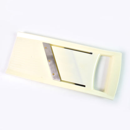 Wukusy adjustable fruit and vegetable slicer for home kitchen, showing the slicer with cut fruits and vegetables.