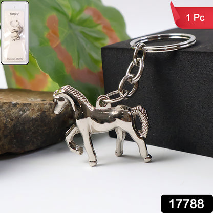 Shiny metallic horse-shaped keychain from Wukusy, featuring a detailed horse design on a silver finish.