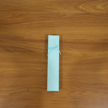 Elegant Wukusy premium long rectangular jewelry gift box with a decorative ribbon on a white background.